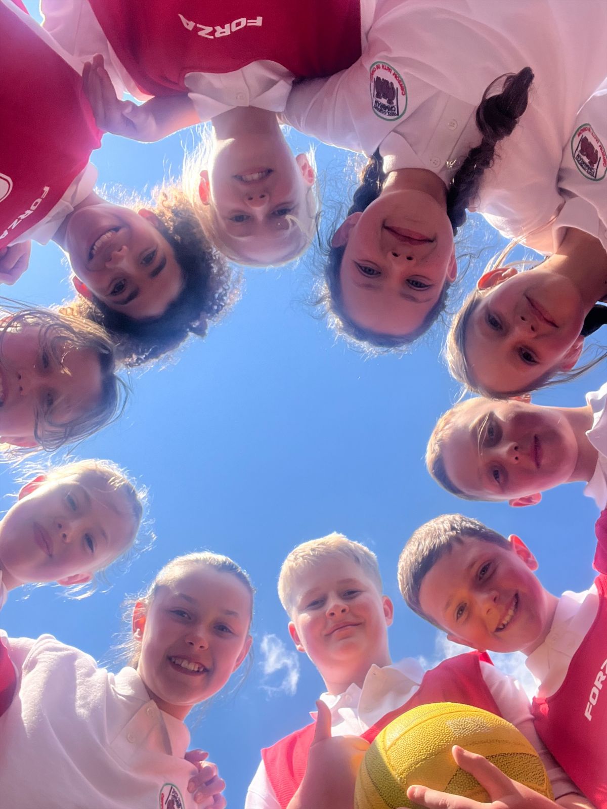 The netball team in a huddle