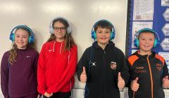 Pupils wearing their new headphones.